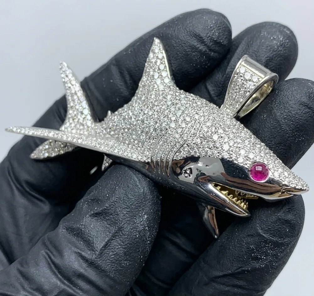Custom pavé diamond shark pendant with ruby eye, finished cast piece