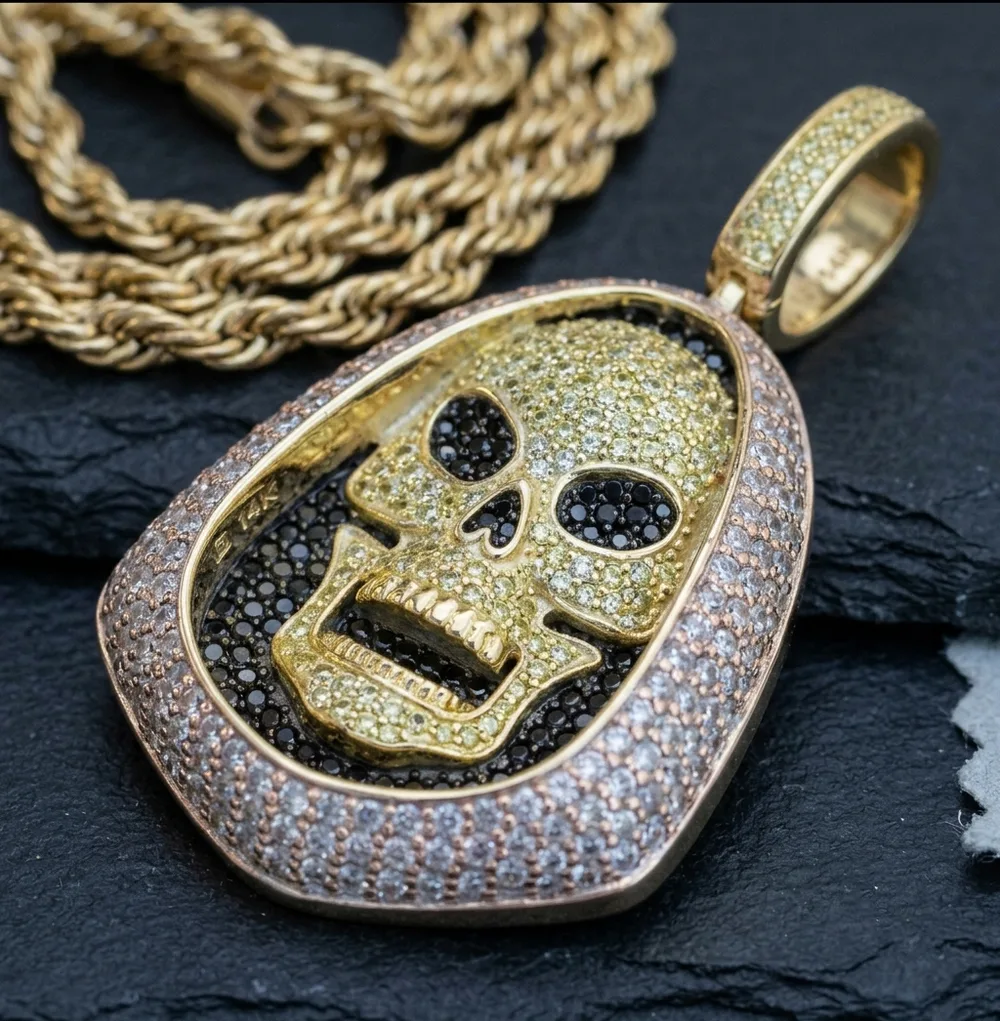 Three-tone gold skull pendant with pavé stones, finished cast piece
